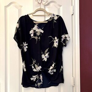 Navi floral v-neck, high/low, twist front at waist, cap sleeved blouse. West Kei